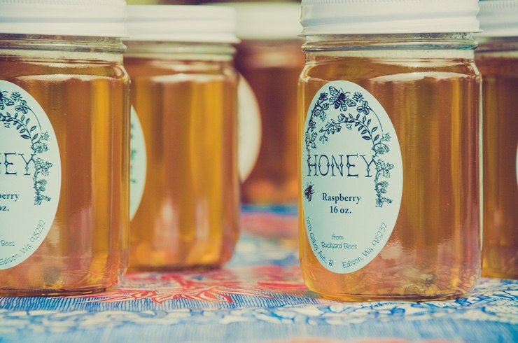 Several jars of honey from a small business presented on a table