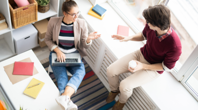 A discussion between two people in a work setting