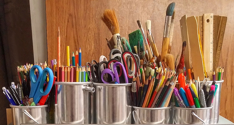 A number of craft supplies organised into different compartments