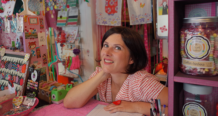 Person smiling at their craft stall