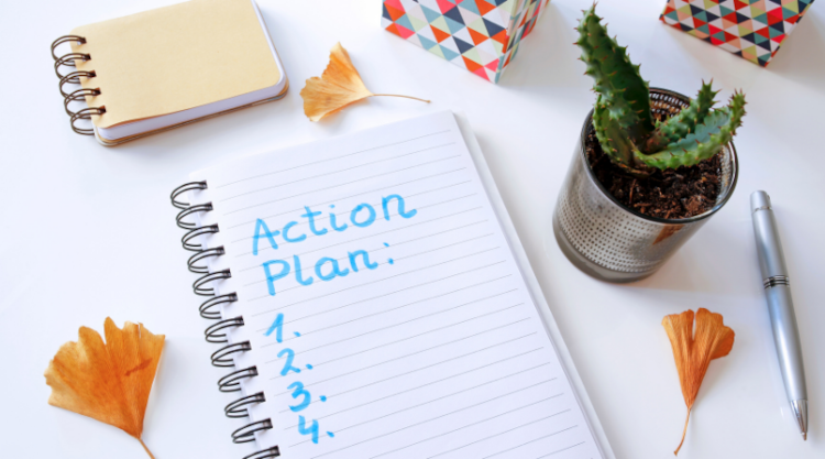 A blank 4 step action plan in a notebook
