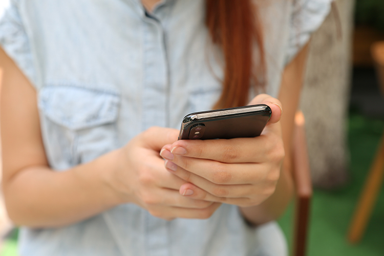 A person with their phone in their hands 