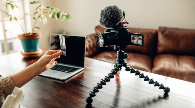 A video setup recording a person sitting at their sofa