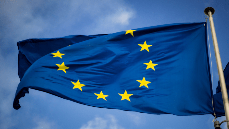 EU flag flying against a clear blue sky